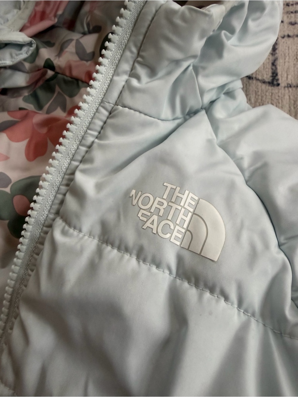 The North Face Kids Pale Blue Puffer Jacket with Floral Lining